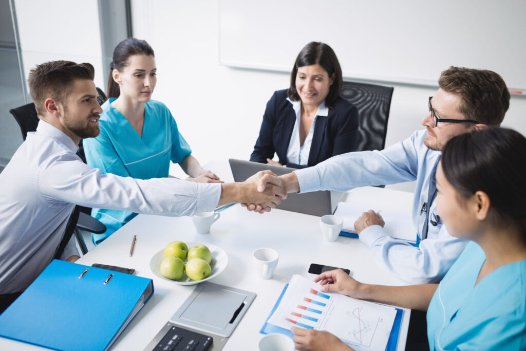 healthcare retention strategies doctors-shaking-hands-with-each other